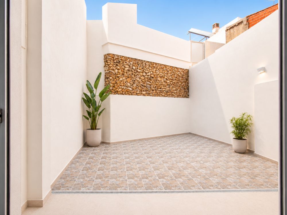 Imagen de reforma de vivienda con patio